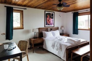 Primary bedroom with Queen bed, luxury bed linens and comfy robes.
