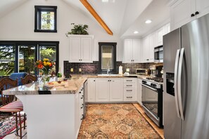 Kitchen with stainless steel appliances and gas stove