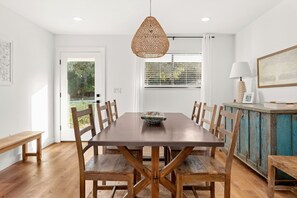 Enjoy a meal at one of the home's two dining tables that seats up to 8.