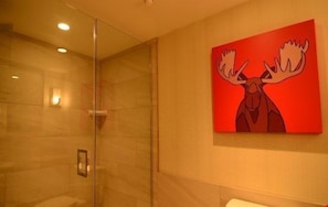 Take a shower in the moose-themed bathroom with accessible features.