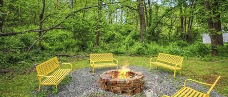 Bring firewood and enjoy S'mores around our fire pit surrounded by trees.