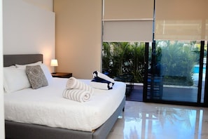 King Bed, direct access to your private poolside patio, ensuite full bath & Smart TV
