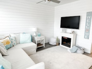 We love the shiplap accent walls for that perfect beach vibe!