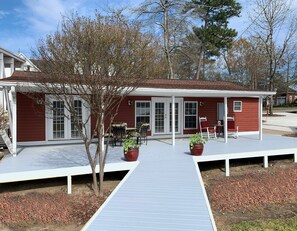 Cottage with 2 sets of French Doors leading to newly renovated deck.