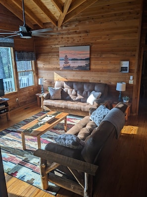Living room with sofas that open up to full size and queen size