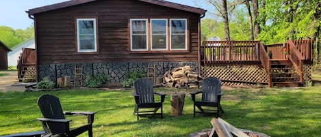 Back yard with firepit and lake entrance