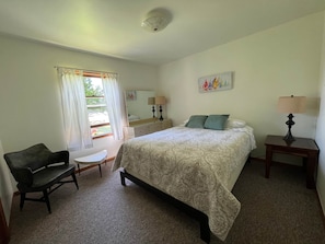 Main level bedroom in Cedar Cottage. Water views