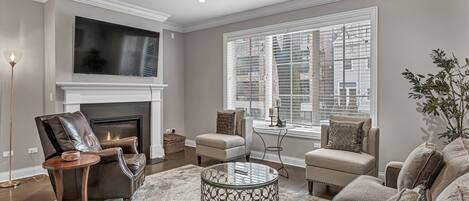 Elegantly designed living room with gas fireplace