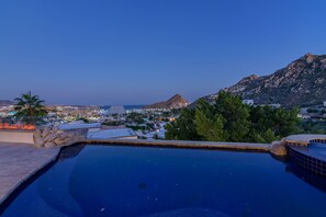 Pool and jacuzzi overlooking ocean views