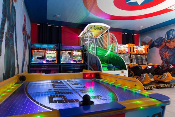 In-house arcade hall with Skee  Ball, Air Hockey, 2 Arcade machines, Basketball game and 2 Motorcycle games.