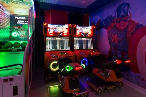 In-house arcade hall with Skee  Ball, Air Hockey, 2 Arcade machines, Basketball game and 2 Motorcycle games.