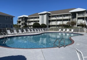 By the pool and has beach access just across the street with pedestrian light