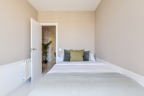 Main view of one of the bedrooms with a double bed