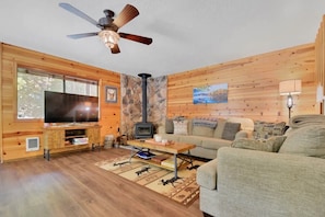 Living room space, with TV hooked up to Xfinity Flex you can access all your streaming services. Or settle in with some board games, books and simply relax!