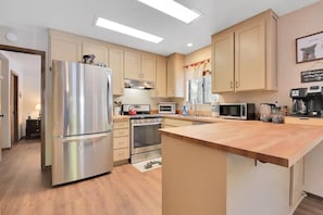 The kitchen is ready to cook, fully stocked - and importantly we have "4 modes of coffee": drip, Keurig, French Press and pour over. Whole beans, pods and assorted teas are stocked.