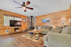 Living room space, with TV hooked up to Xfinity Flex you can access all your streaming services. Or settle in with some board games, books and simply relax!