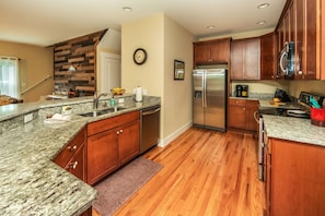 The kitchen has all stainless steel appliances, granite and is well stocked.