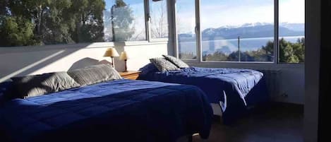 Main room in first floor with queen bed and single bed and stunning views