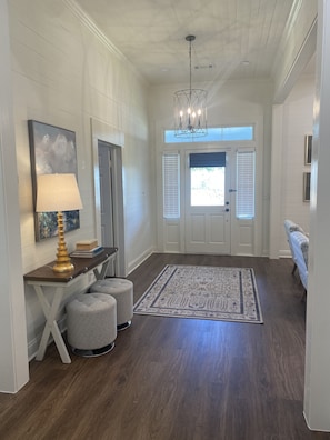 Foyer open to den.
