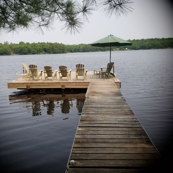 Large sunny dock with swim ladder