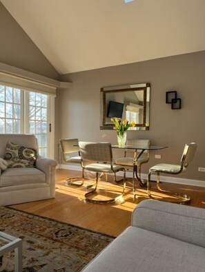 Dining room table with adjacent door leading to the backyard patio