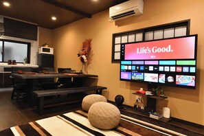 65-inch 4K flat-screen TV (compatible with entertainment features such as Netflix and YouTube)