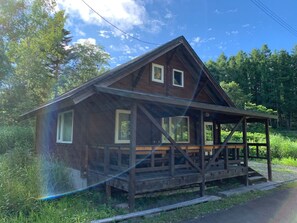Log cottage exterior (summer)