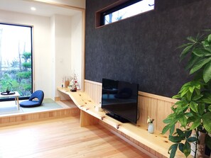 ・[Building A] The living room is equipped with a large TV.