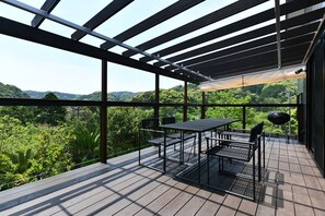 Wood deck where green and wind intersect. Enjoy the beautiful shades of the mountains and the breeze blowing through.