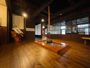 A room with a hearth. Dinner will be served here.