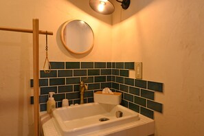 The washbasin is retro with an experimental sink