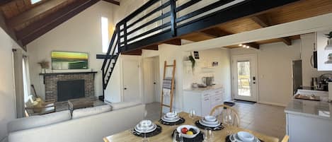 Open floor plan of living room, dining area and kitchen.