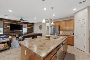 Kitchen with dishwasher and pantry.