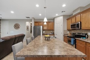 Large island that is perfect for prepping or having breakfast.
