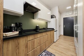 The fully equipped kitchenette includes everything you need for a home-cooked meal.