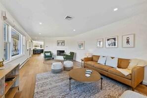 Comfortable living room with wood burning fireplace and plenty of space to kickback and relax