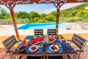 Partially sheltered terrace area for outdoor dining