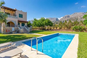 Beautiful villa with private pool, terrace, and lawn with sea views