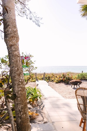 Paved walkway and stairs to your private sandy oasis.
