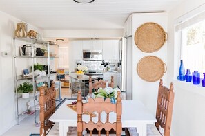Enter the  kitchen/ dining area with all the equipment you need to chef up a homecooked meal. 