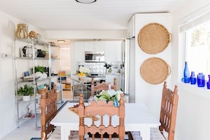 Enter the kitchen/ dining area with all the equipment you need to chef up a homecooked meal.