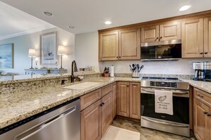 Fully Equipped Kitchen with Granite Countertops and Stainless Appliances