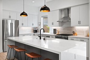 A sleek kitchen with a spacious island
