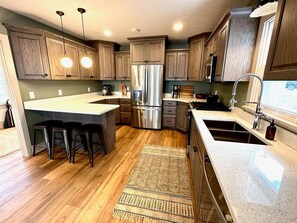 Freshly updated kitchen with granite countertops & all new appliances.