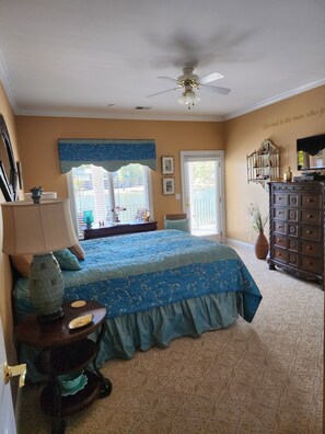 Island's Sunset Gold Guest Room with view of Lake Murray through the windows.