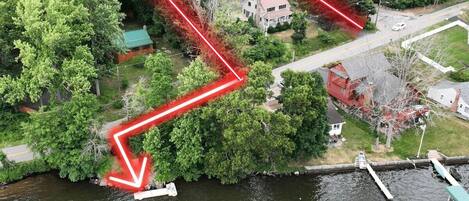 BELL HOUSE  Drone shot with property lines and an arrow to show you, your private dock in the Lake! ✨