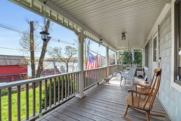 Front Porch with a Lake View!!!  We have multiple rocking chairs and other chairs for the whole family.  Very Popular amongst guests.