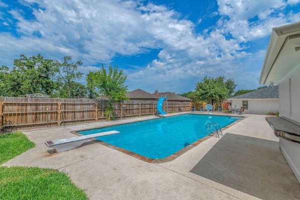 10 feet deep, 1500 square foot pool! With diving board and waterslide.
