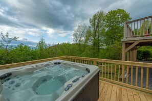 Relax & enjoy mountain views in the newly-added hot tub with a glass of wine.