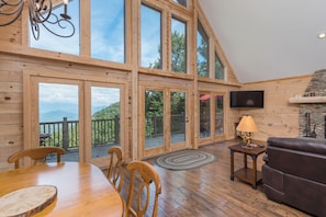 Gather in the great room complete with gorgeous floor-to-ceiling window views of the majestic Blue Ridge Mountains just outside.